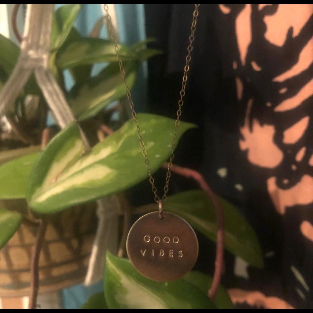 Circle stamped printed “Good Vibes”